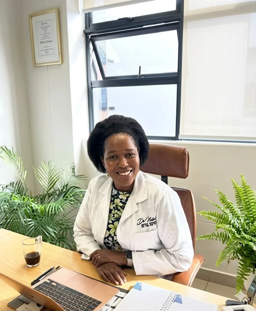 Dr. Nokwazi Ndlela seated in luxury clinical reception lounge